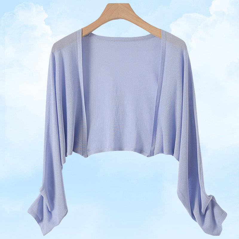 Cardigan en maille soleil pour rester au frais et au goût du jour