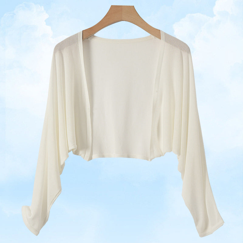 Cardigan en maille soleil pour rester au frais et au goût du jour