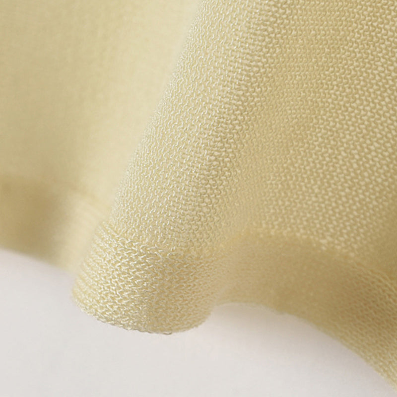Cardigan en maille soleil pour rester au frais et au goût du jour