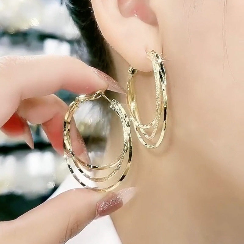 Boucles d'oreilles créoles multicouches