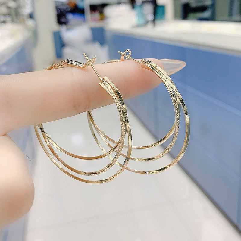 Boucles d'oreilles créoles multicouches