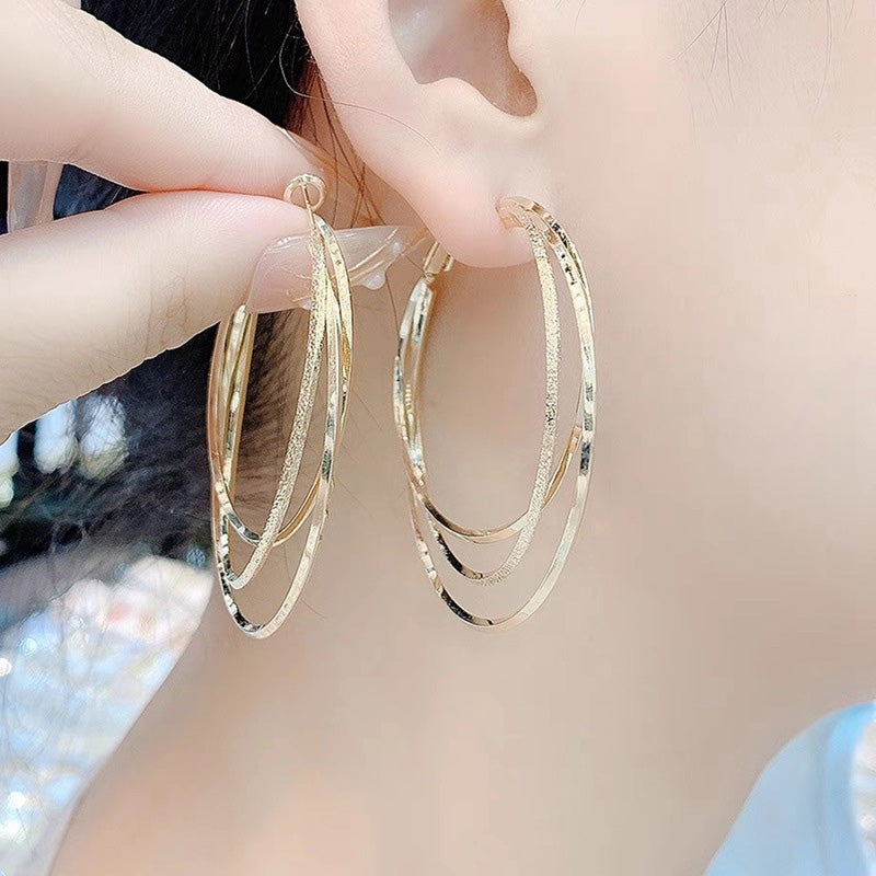 Boucles d'oreilles créoles multicouches