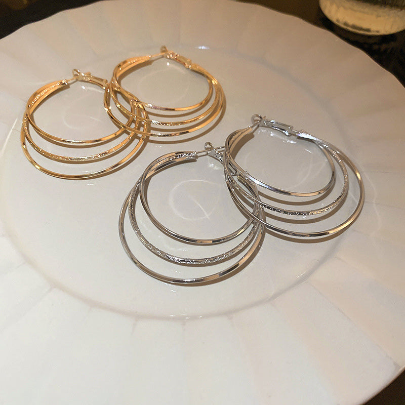 Boucles d'oreilles créoles multicouches