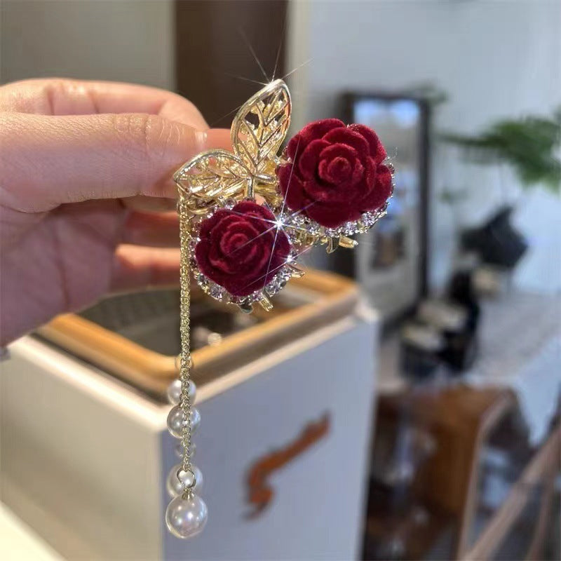 Pince à queue de cheval pompon rose